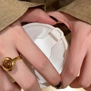 Elegant Gold-Tone Ring with Black Stone